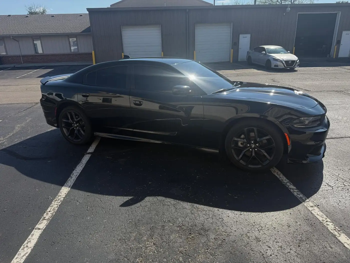 Black Dodge Charger with dark window tint in the Tint-Factory lot in Dayton