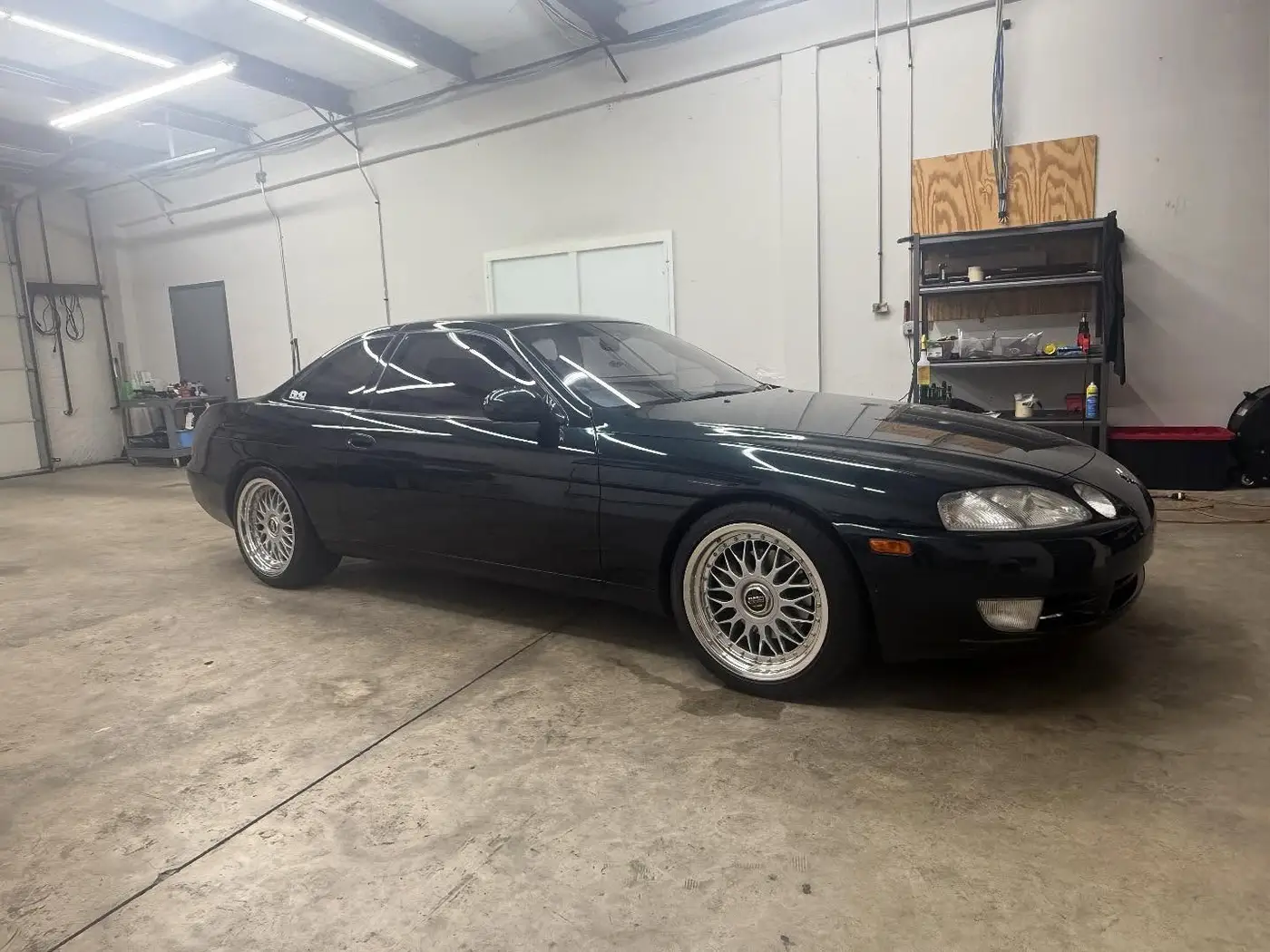 Black Lexus SC coupe on BBS style wheels with window tint