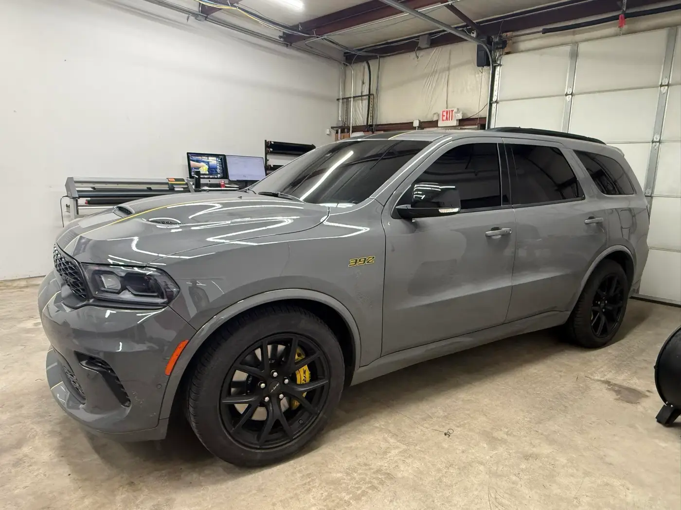 Gray Dodge Durango with tinted windows in the shop